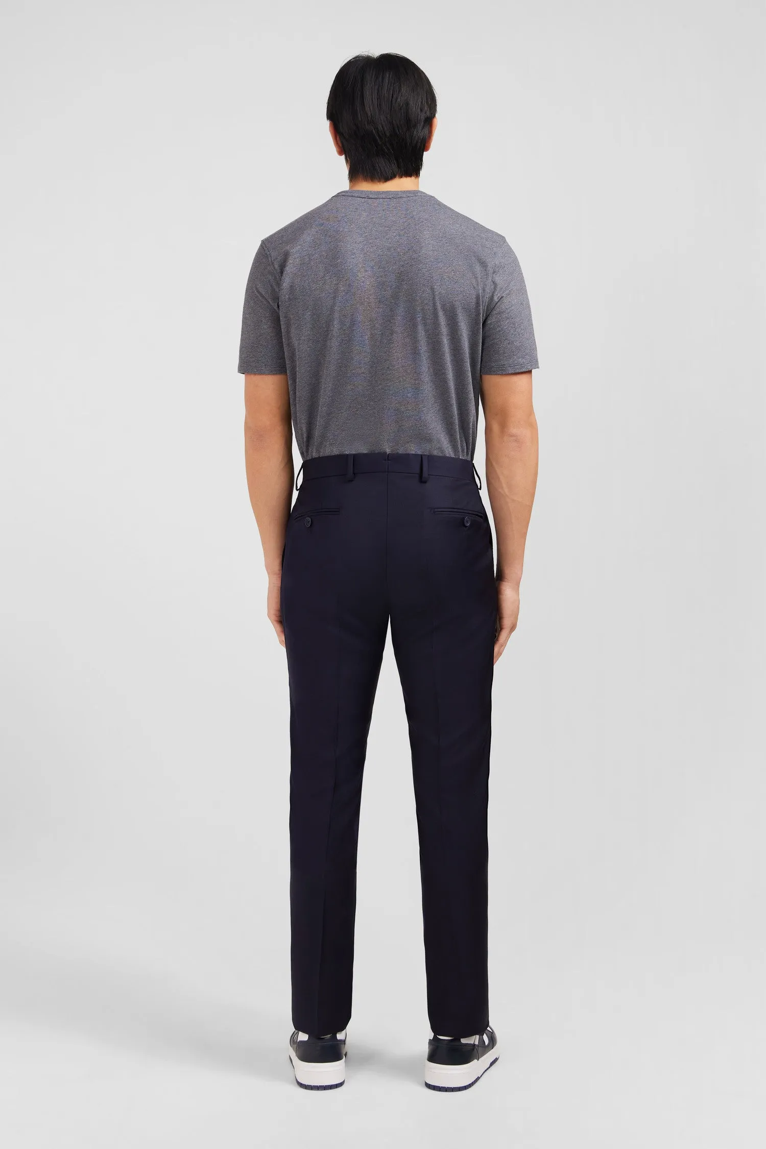 Slim dark blue wool trousers with broken fold